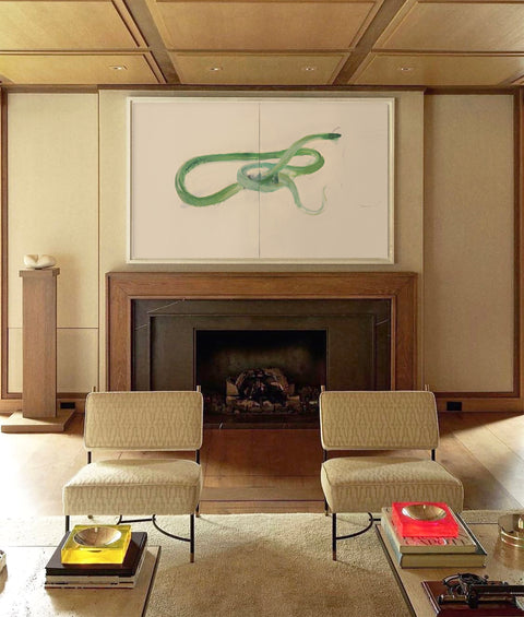 an oversized abstract canvas art hanging on the living room's wall