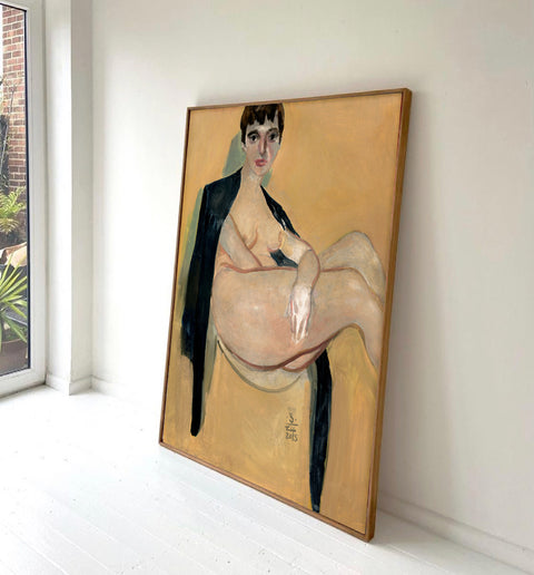 a large portrait canvas art sitting on the floor