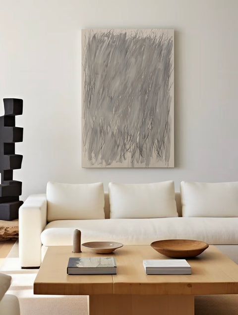 a large abstract canvas art hanging on the living room's wall