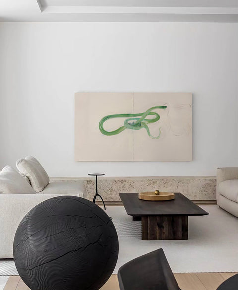 an oversized abstract canvas art hanging on the living room's wall