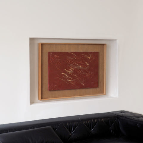 a large abstract canvas art hanging on the living room's wall