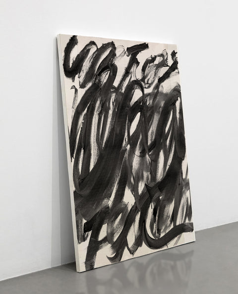 a large abstract canvas art sitting on the floor